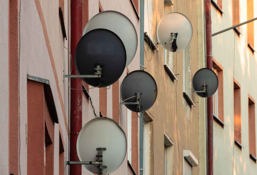 Different DSTV dish hung on the wall