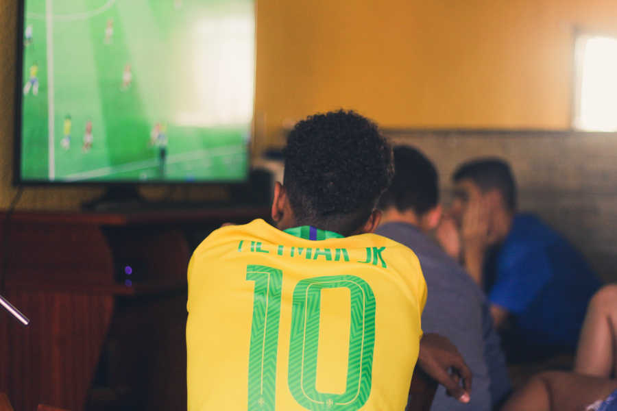 Group of Guys watching football at the viewing center after DSTV installation