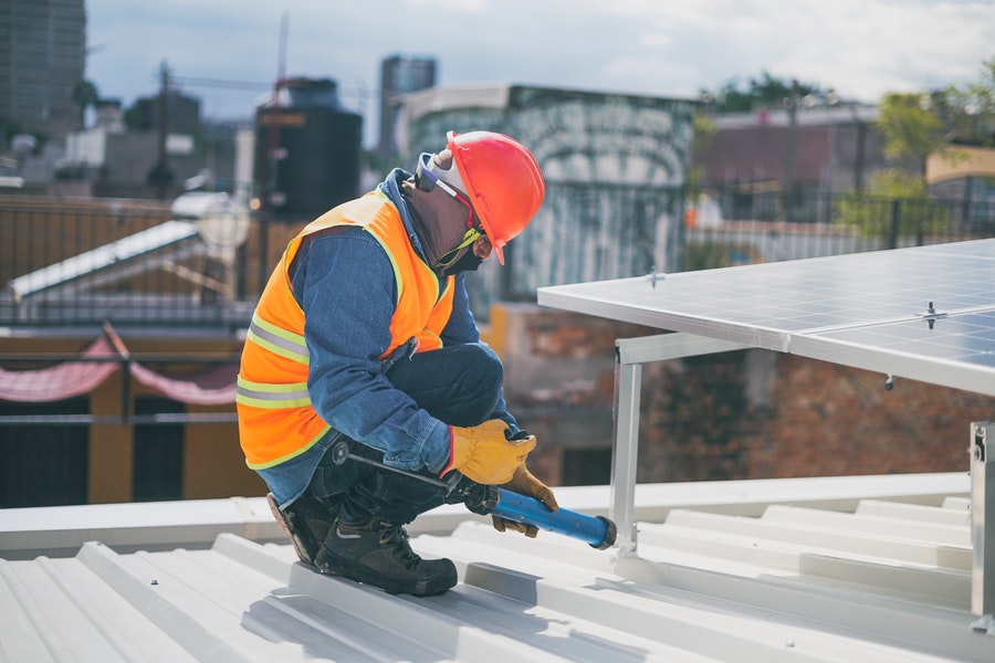 A guy installing the solar panels